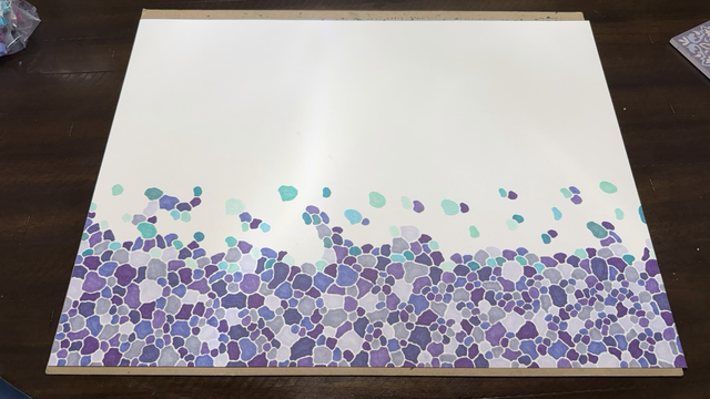 Wide shot of new drawing involving covering the canvas with blobby shapes, in shades of purple and teal