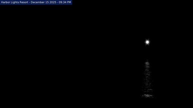 Western view from Harbor Lights Resort in Frankfort of the Frankfort Lighthouse and breakwaters separating Frankfort Harbor from Lake Michigan. // Image captured at: 2025-12-16 02:36:03 UTC (about 1 min. prior to this post) // Current Temp in Frankfort: 23.18 F | -4.90 C // Precip: overcast clouds // Wind: NW at 2.304 mph | 3.70 kph // Humidity: 74%