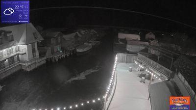 View of the outdoor dining area for The Cove Restaurant and the larger Fishtown complex overlooking a channel leading to Lake Michigan. // Image captured at: 2025-12-16 05:31:32 UTC (about 5 min. prior to this post) // Current Temp in Leland: 21.65 F | -5.75 C // Precip: overcast clouds // Wind: S at 1.990 mph | 3.20 kph // Humidity: 90%