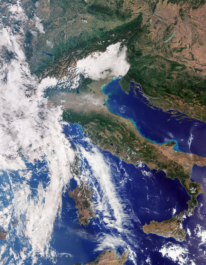 This first image, captured by the ocean and land colour instrument on 30 September, is a striking natural-colour view that reveals Italy in beautiful detail, stretching from southern Germany in the north to Sicily and the southern Mediterranean.

Just above the centre of the image, the broad, flat expanse of the Po Valley – Italy’s agricultural heartland – stands out in shades of brown and green. Just to the north, the snow-capped Alps form a dramatic contrast with the lowlands, their bright peaks clearly visible against the surrounding landscape. Across the rest of Italy, variations in green and brown reflect differences in vegetation, agriculture and other types of land cover.

To the east, the deep blue waters of the Adriatic Sea separate Italy from the Balkan Peninsula, which is partially visible in the image. Noticeable variations in sea colour can be seen along Italy’s eastern coastline, where lighter blue waters hug the shore. These brighter tones are likely caused by sediment carried into the sea by rivers and transported along the coast.

On Italy’s western side, the dark waters of the Tyrrhenian Sea surround the islands of Sardinia and Sicily, which are clearly visible, while Corsica is largely obscured by cloud. Together, the contrasting colours of the land, snow-covered mountains and surrounding seas provide a vivid view of Italy’s diverse landscape from space.

CREDIT: contains modified Copernicus Sentinel data (2026), processed by ESA