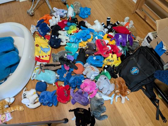 A giant pile of PHP elephant plushies all over the floor.