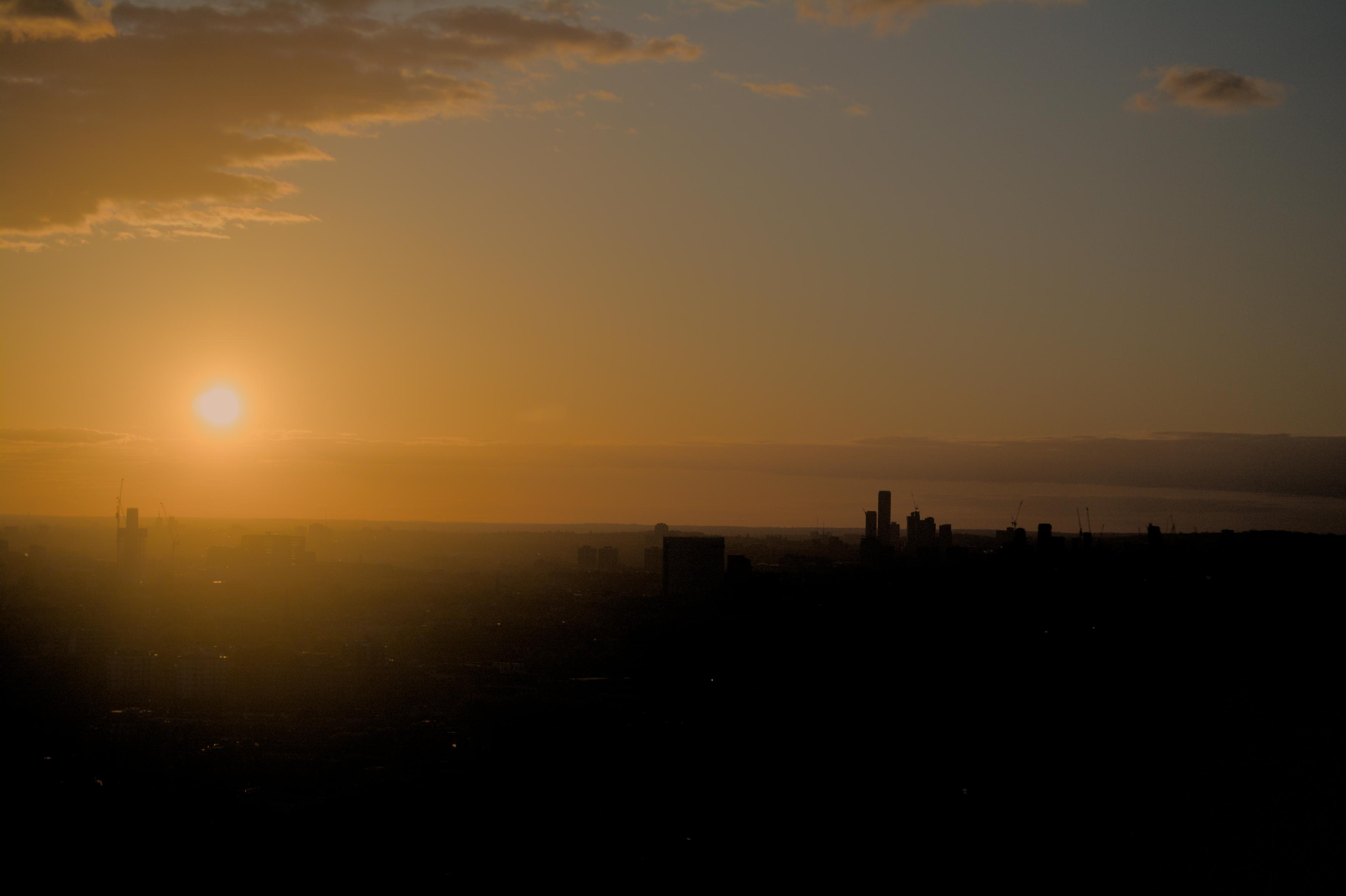 A view of a sunset across the London (UK) skyline from the top of Battersea Powerstation
